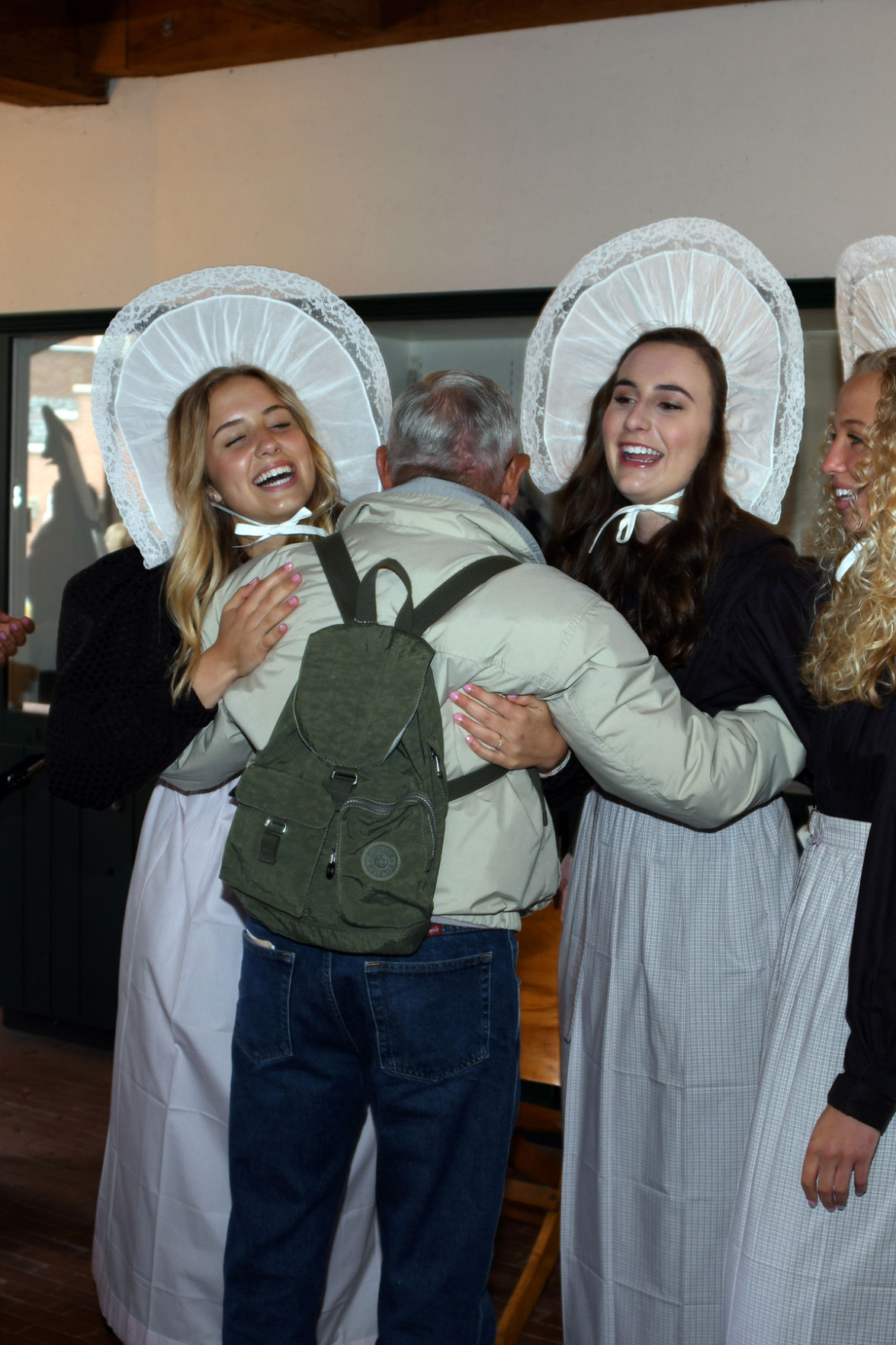 189 Don Regier gets a hug from Queen Olivia and her attendant.JPG